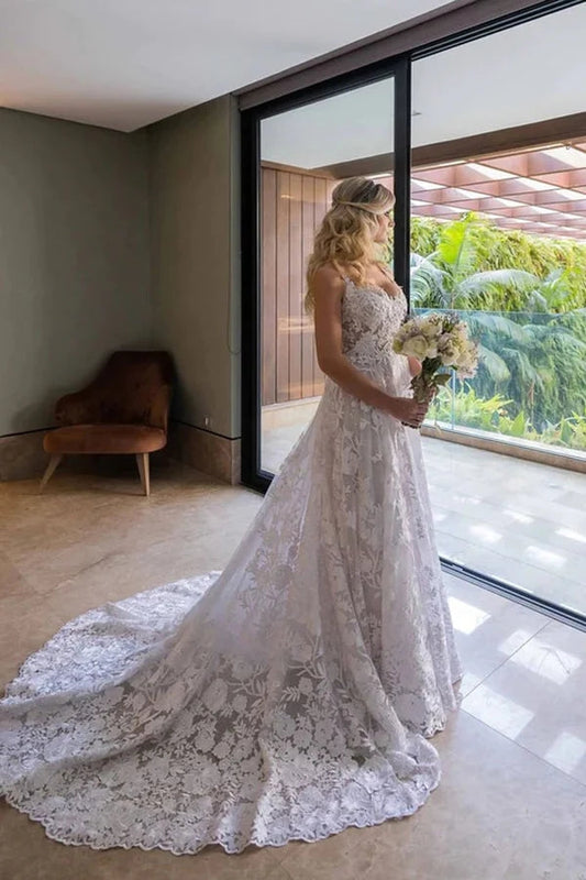 Vestido de novia blanco de encaje con mangas largas desmontables
