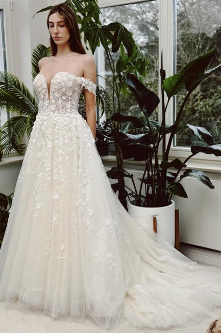 Vestido de novia elegante, largo, color marfil, corte A, hombros descubiertos, escote en V, sin mangas y con encaje