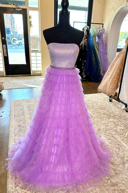 Vestido de fiesta largo en capas color lila, sin tirantes, con corte A y pedrería