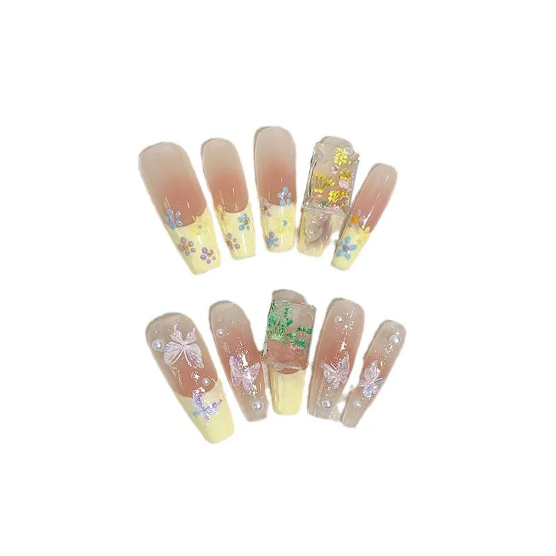 Uñas postizas suaves y extraíbles con diseño de cinta color nude a juego en amarillo tipo escalera larga