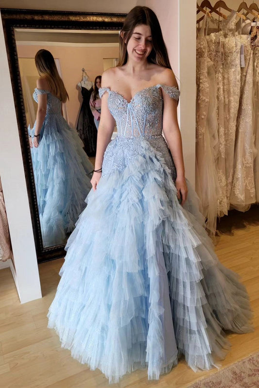Vestido de fiesta largo con volantes, hombros descubiertos y apliques azul claro