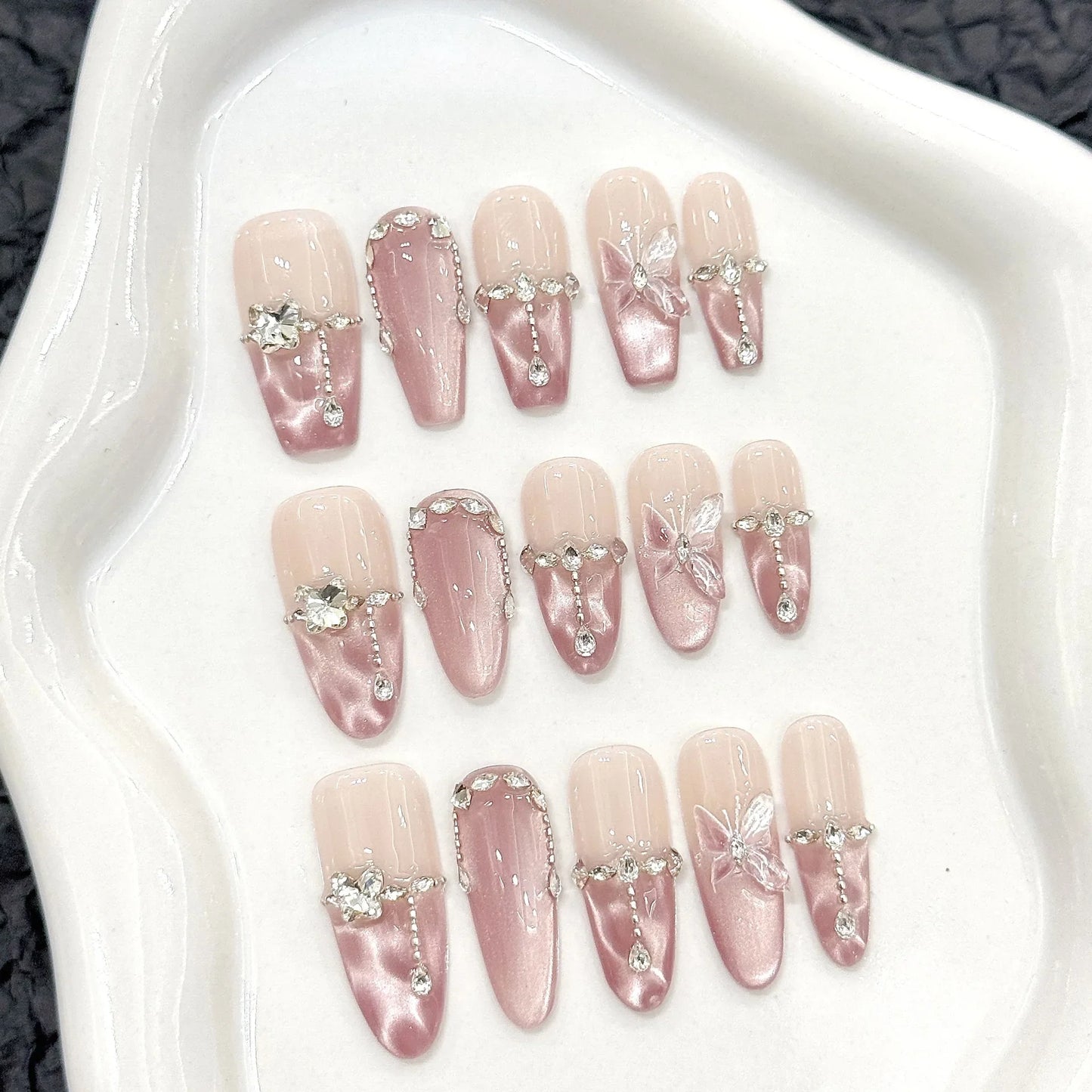 10 uñas postizas hechas a mano con diseño de mariposa de cristal, brillantes y decorativas, estilo francés, con diseño de ojo de gato rosa dulce.