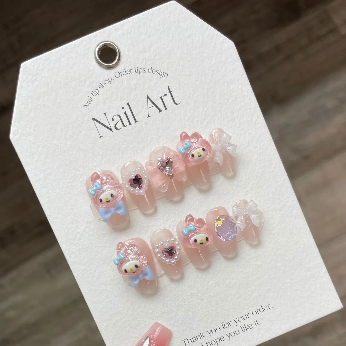 10 uñas postizas hechas a mano, color rosa claro, con diseño de dibujos animados, parches con lazos 3D y perlas, puntas de uñas postizas coreanas.