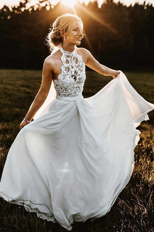 Vestido de novia largo de gasa sin mangas con cuello halter y encaje para playa