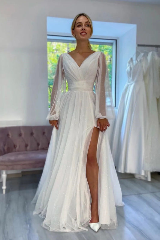Fabuloso vestido de novia blanco largo con escote en V, mangas largas y purpurina con abertura