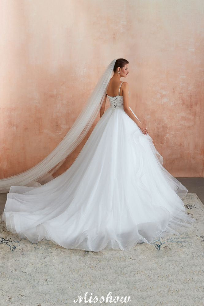 Vestido de novia blanco con cola de capilla, tirantes finos, transparente y con cordones, a la venta.