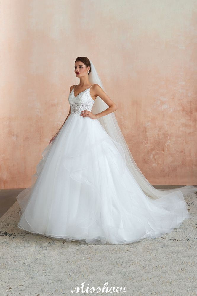 Vestido de novia blanco con cola de capilla, tirantes finos, transparente y con cordones, a la venta.