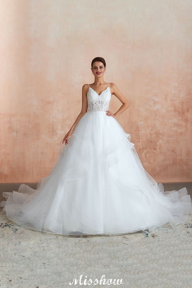Vestido de novia blanco con cola de capilla, tirantes finos, transparente y con cordones, a la venta.
