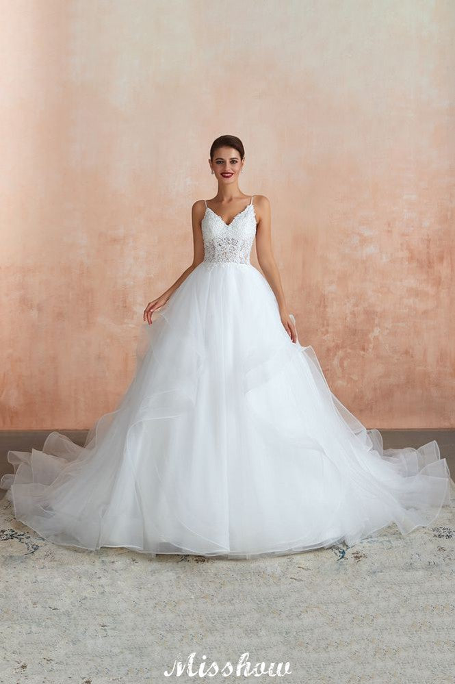 Vestido de novia blanco con cola de capilla, tirantes finos, transparente y con cordones, a la venta.