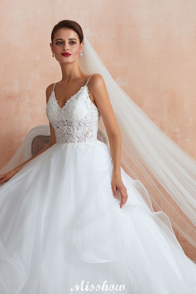 Vestido de novia blanco con cola de capilla, tirantes finos, transparente y con cordones, a la venta.