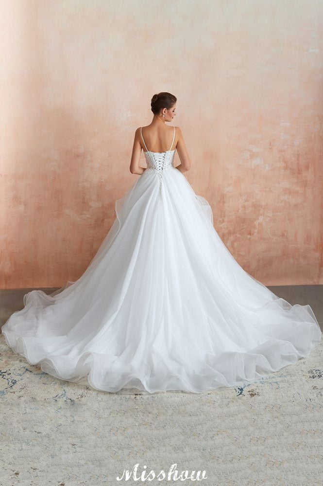 Vestido de novia blanco con cola de capilla, tirantes finos, transparente y con cordones, a la venta.