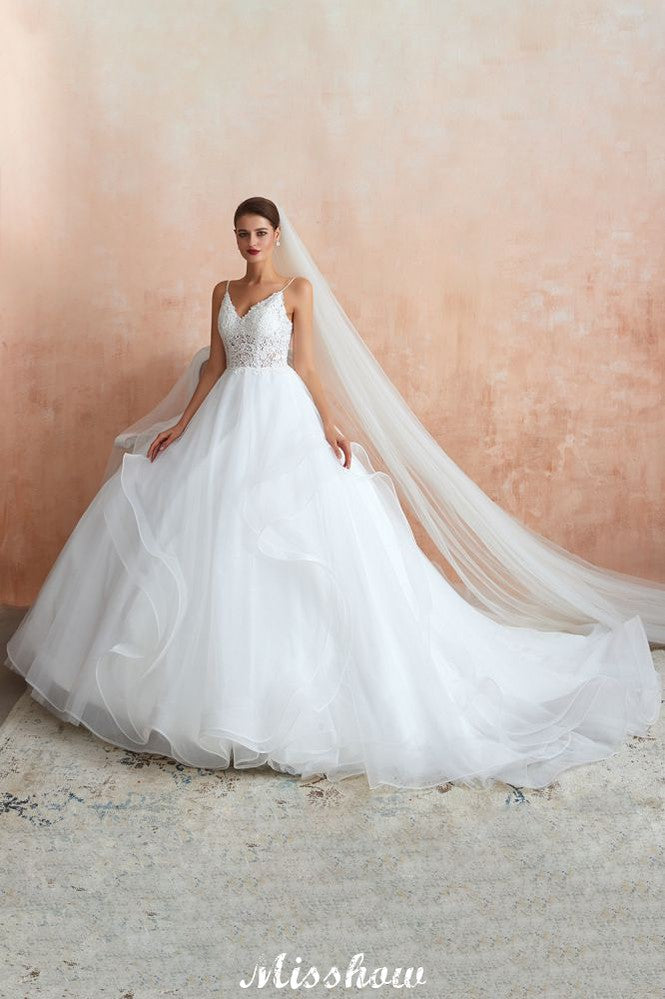 Vestido de novia blanco con cola de capilla, tirantes finos, transparente y con cordones, a la venta.