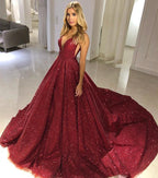 Abito da sera bordeaux con scollo a V, spalle scoperte e paillettes, linea a trapezio
