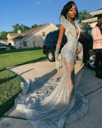 Silver Ice Crystal Beaded Mermaid Gown With Deep V Neck And Cascading Fringe