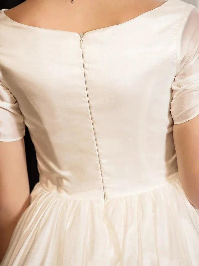 Back view of 1950s vintage short A-line wedding dress with sleeves, zipper and tea-length skirt.