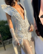 Silver Ice Crystal Beaded Mermaid Gown With Deep V Neck And Cascading Fringe