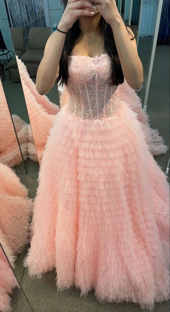 Robe de bal rose sans bretelles avec corsage en dentelle transparente et jupe à volants Y6688