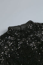 Abito da sera lungo con collo alto scintillante, maniche lunghe, tagli laterali e spacco alto con paillettes