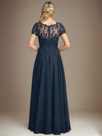 Robe de mère de la mariée en mousseline, longueur au sol, coupe en A, décolleté arrondi, ornée d'appliques et de paillettes