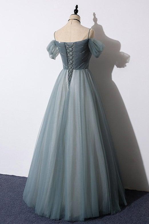 Abito da sera grigio in tulle con scollo a barca e linea a trapezio