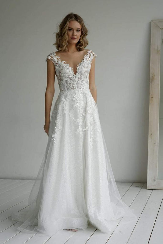 Robe de mariée élégante en tissu pailleté coupe A avec décolleté en cœur et appliques WD570