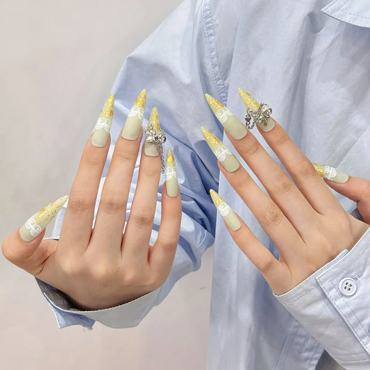 Uñas postizas adhesivas de primera calidad con diseño de gota de agua larga amarilla y diamantes de imitación extraíbles para salón de arte. 