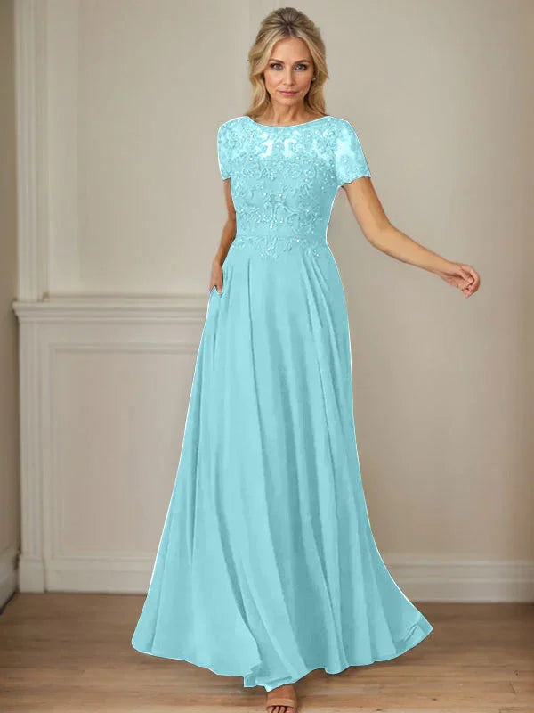 فستان شيفون كحلي داكن برقبة قارب وتطريز بالترتر على شكل حرف A