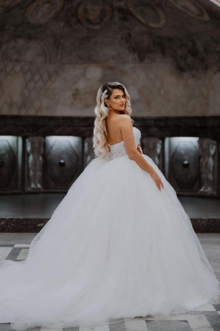 Robe de bal bustier sans manches charmante en tulle longue jusqu'au sol avec applications pour mariage
