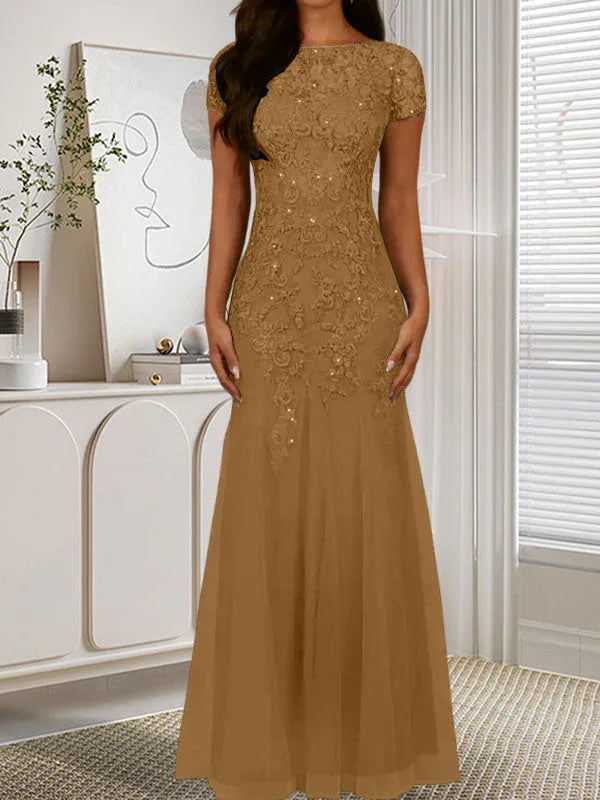 فستان تول مزين بحراشف لامعة برقبة دائرية بلون كحلي داكن على شكل حورية البحر