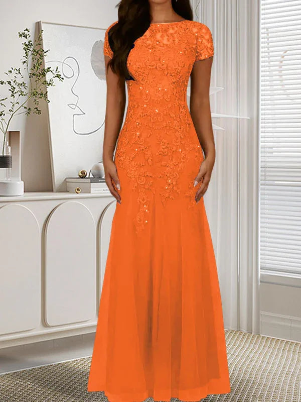 فستان تول مزين بحراشف لامعة برقبة دائرية بلون كحلي داكن على شكل حورية البحر