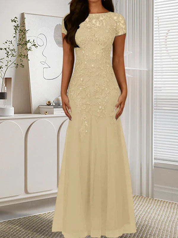 فستان تول مزين بحراشف لامعة برقبة دائرية بلون كحلي داكن على شكل حورية البحر