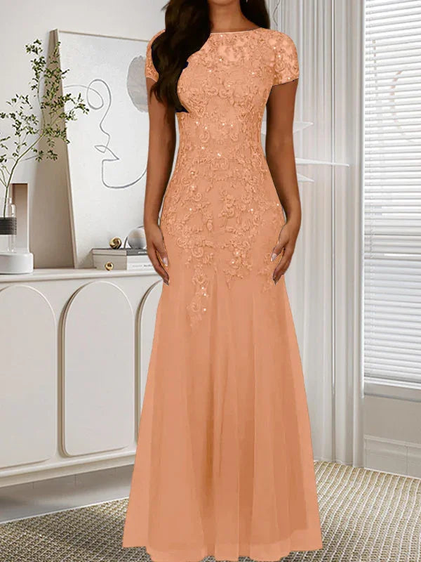 فستان تول مزين بحراشف لامعة برقبة دائرية بلون كحلي داكن على شكل حورية البحر