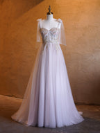 Abito lungo da cerimonia a linea ad A con corsetto, applicazioni, fiocco in tulle e spalline, con strascico fluente