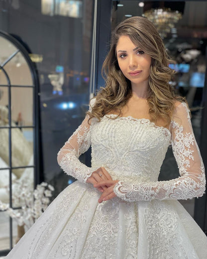 Deluxe bodenlanges, langärmliges A-Linien-Brautkleid aus Spitze mit Rüschen