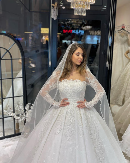 Deluxe bodenlanges, langärmliges A-Linien-Brautkleid aus Spitze mit Rüschen