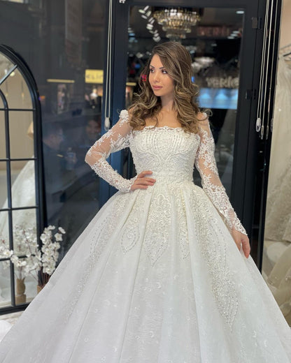 Deluxe bodenlanges, langärmliges A-Linien-Brautkleid aus Spitze mit Rüschen