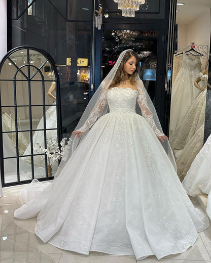 Deluxe bodenlanges, langärmliges A-Linien-Brautkleid aus Spitze mit Rüschen