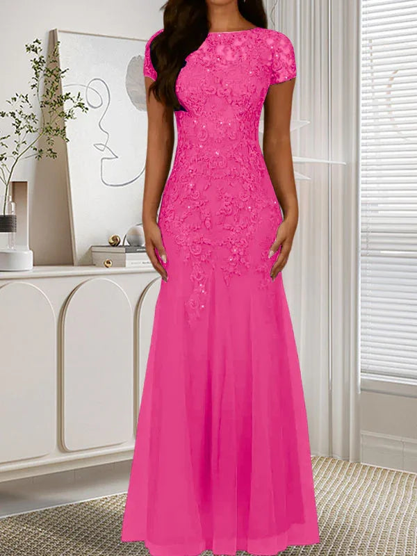 فستان تول مزين بحراشف لامعة برقبة دائرية بلون كحلي داكن على شكل حورية البحر