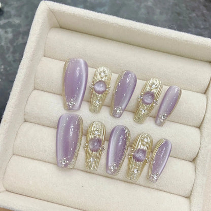 Uñas postizas artificiales pintadas a mano con diseño de lazo mixto de diamantes de imitación, estilo dulce y genial, en negro y rosa. 