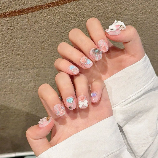 Nuevo estilo de uñas postizas de lujo con purpurina, cortas, con lazo, corazón y diamante. 