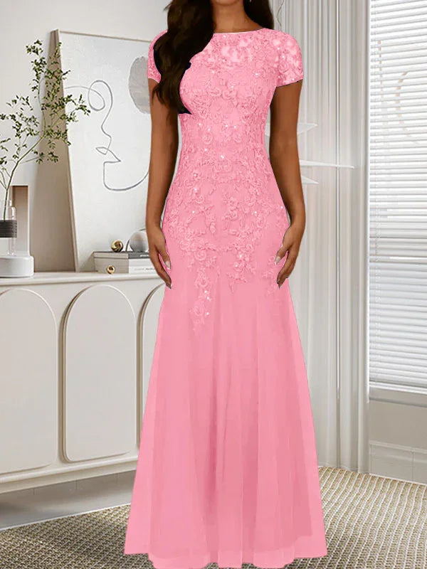 فستان تول مزين بحراشف لامعة برقبة دائرية بلون كحلي داكن على شكل حورية البحر