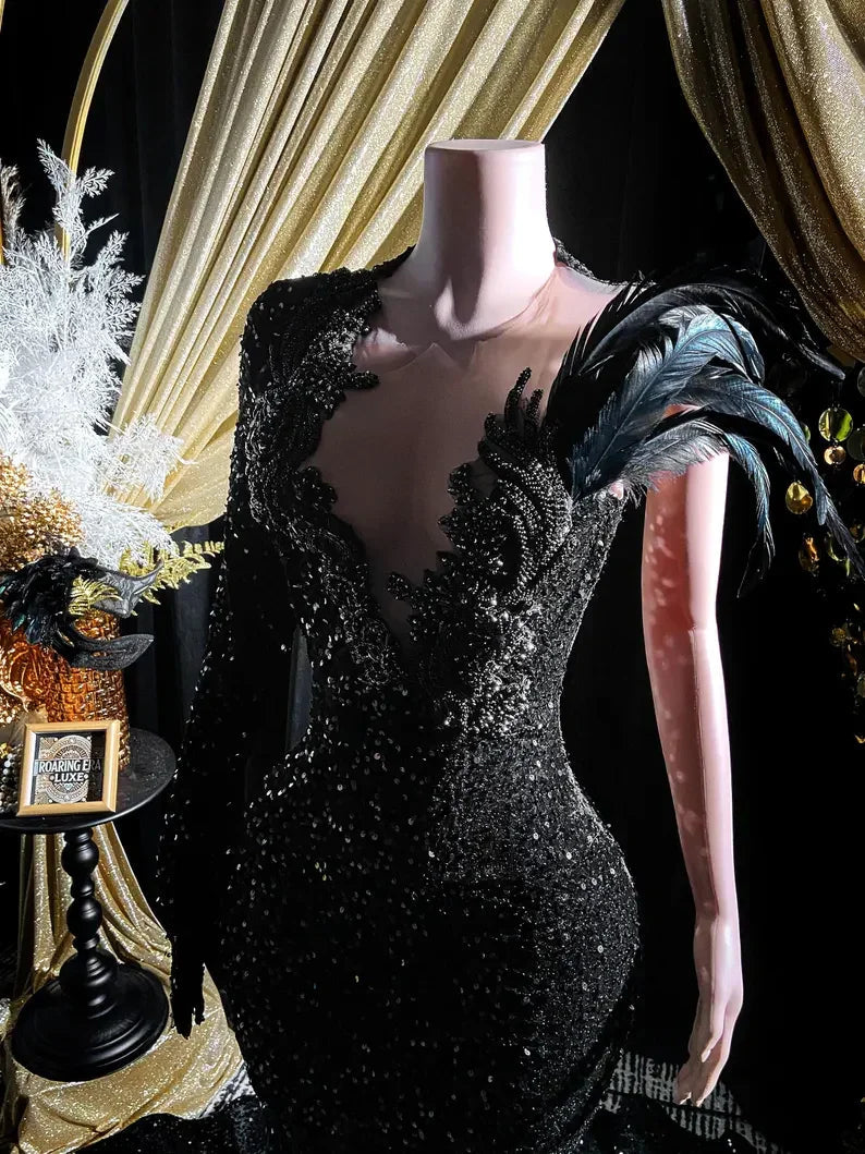 Abito da sera lungo a sirena con maniche lunghe, applicazione di paillettes nere e strass Y8313