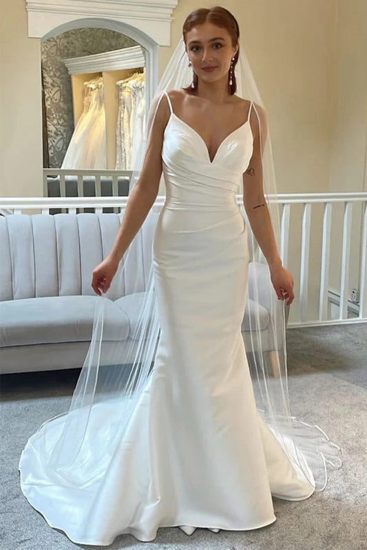 Elfenbeinfarbenes rückenfreies Trompeten-Brautkleid mit Spaghettiträgern
