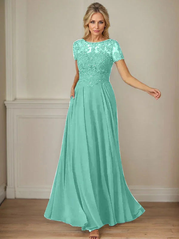 فستان شيفون كحلي داكن برقبة قارب وتطريز بالترتر على شكل حرف A