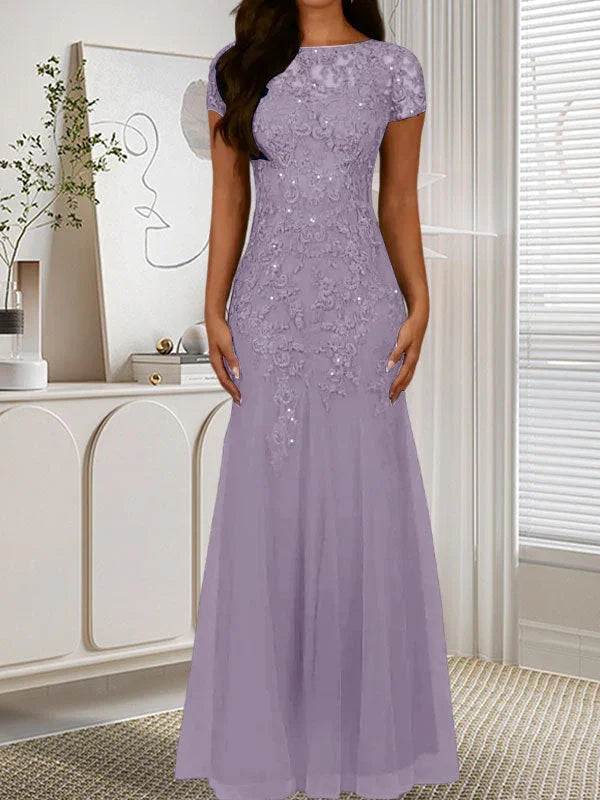 فستان تول مزين بحراشف لامعة برقبة دائرية بلون كحلي داكن على شكل حورية البحر