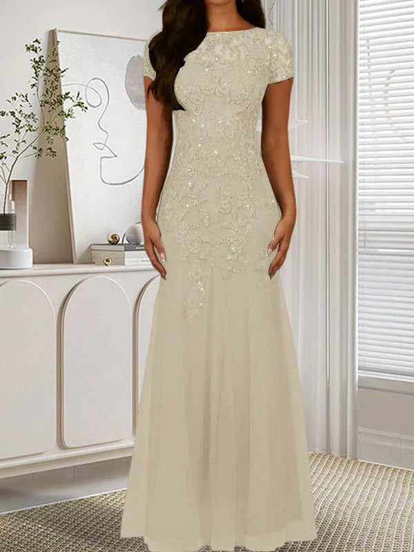 فستان تول مزين بحراشف لامعة برقبة دائرية بلون كحلي داكن على شكل حورية البحر