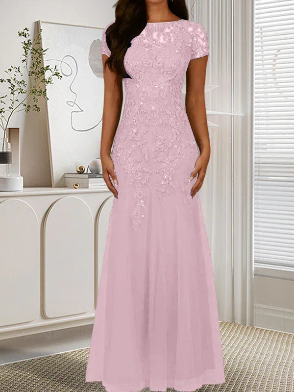 فستان تول مزين بحراشف لامعة برقبة دائرية بلون كحلي داكن على شكل حورية البحر