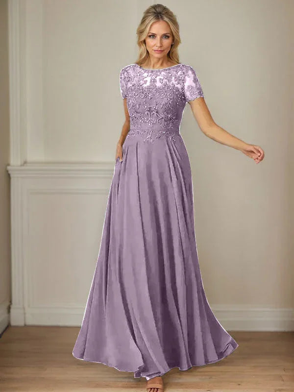 فستان شيفون كحلي داكن برقبة قارب وتطريز بالترتر على شكل حرف A