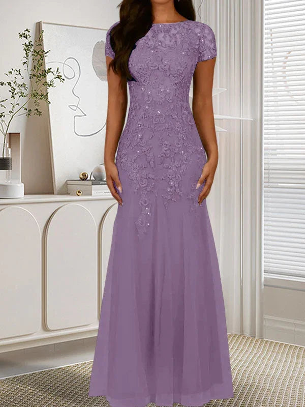 فستان تول مزين بحراشف لامعة برقبة دائرية بلون كحلي داكن على شكل حورية البحر