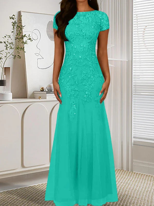 فستان تول مزين بحراشف لامعة برقبة دائرية بلون كحلي داكن على شكل حورية البحر